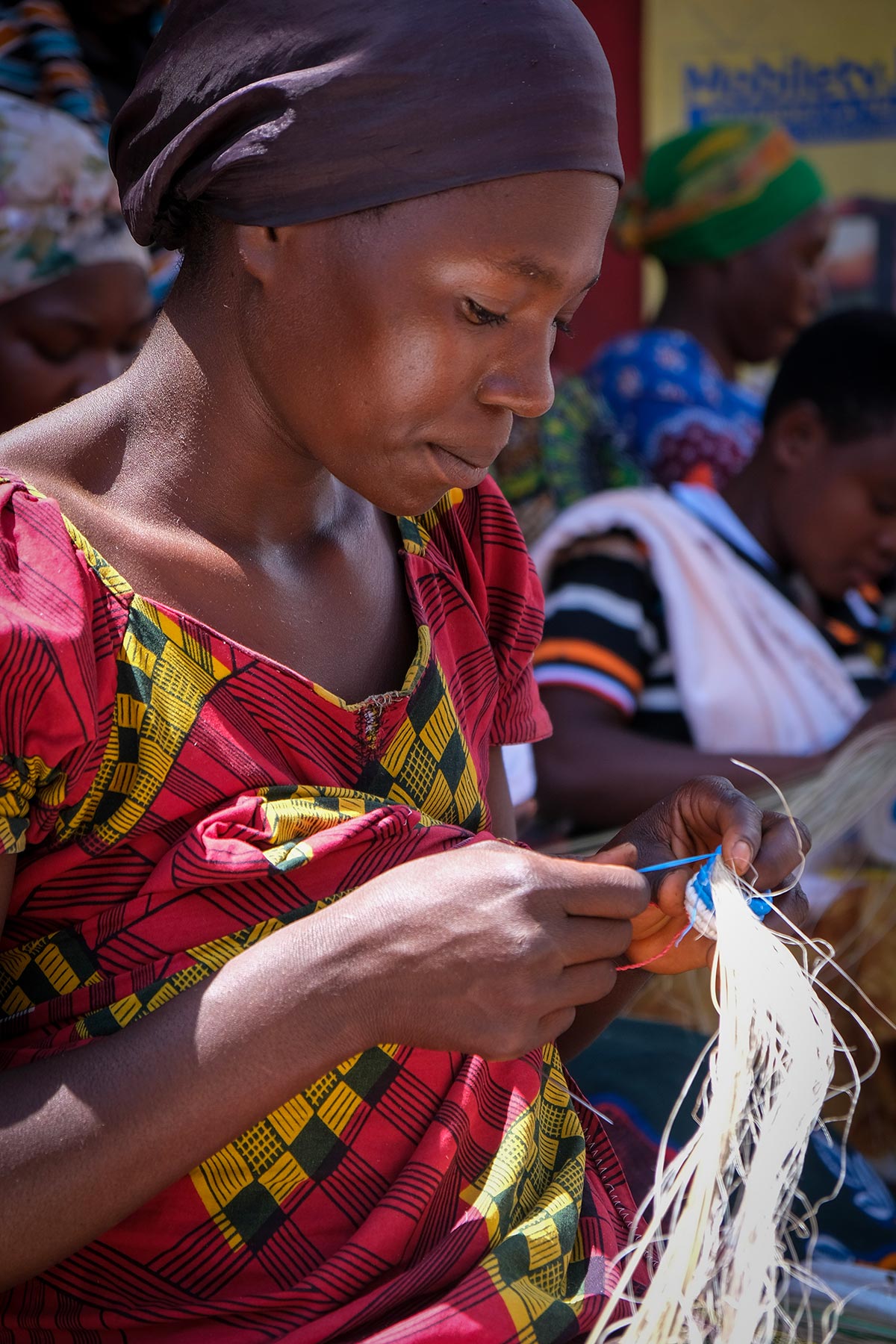Members of Péline’s cooperative make woven baskets for additional income.