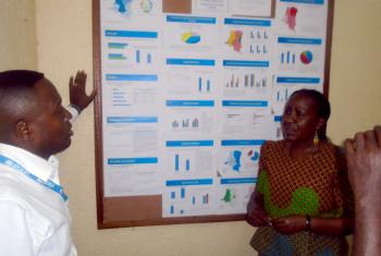 Patrick Matala head of Unicef Kananga explaining access to basic services to Anne Wangari from LWF. Photo: LWF/DRC