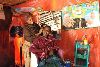 Suhai Ismael Abuker with a customer in her hairdressing salon. Photos: LWF/C. Kästner