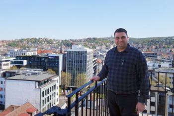 Adam Gnany, verger at the Hospitalkirche, at the roof of the church enjoying the wonderful view over Stuttgart. Photo: EMH/Ute Dilg