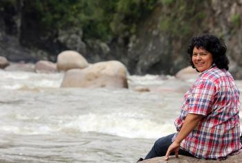 Berta Caceres stands at the Gualcarque River in the Rio Blanco region of western Honduras where she, COPINH (the Council of Popular and Indigenous Organizations of Honduras) and the people of Rio Blanco have maintained a two year struggle to halt construction on the Agua Zarca Hydroelectric project, that poses grave threats to local environment, river and indigenous Lenca people from the region. Photo: Tim Russo/Goldman Environmental Prize