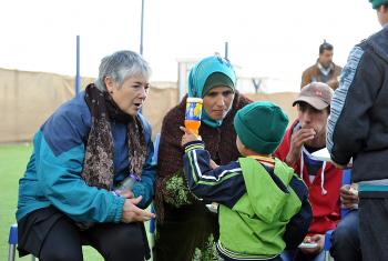 Rev. Dr Gloria Rojas Vargas, LWF Vice President and former president of the Evangelical Lutheran Church in Chile, shares a joke with Ahmad at the LWF Peace Oasis in Za’atari refugee camp. Photo: LWF/ C. Kästner