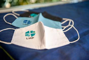 Wear it, share it. LWF embroidered protective face masks. Photo: LWF/S. Gallay 