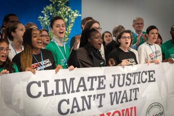 Young climate activists gathered in December 2019 at the COP25 summit in Madrid, Spain sound the alarm for climate justice. Photo: LWF/Albin Hillert