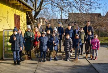 Pastor Miroslav Ponjičan (back right) with youth and children, preparing for a tree planting activity in the Slovak Evangelical Church of the Augsburg Confession in Serbia (SEAVC). Photos: SEAVC