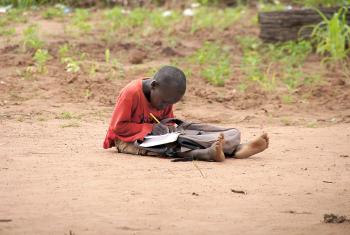 A young boy doing his homework in Yida refugee camp, South Sudan. Photo: LWF/ M. Hyden