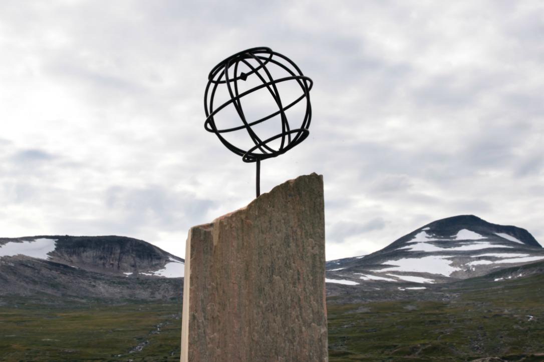 A monument marks the Arctic Circle in Saltfjellet, Norway. Snow previously covered these mountaintops all year round. Photo: Ryan Rodrick Beiler