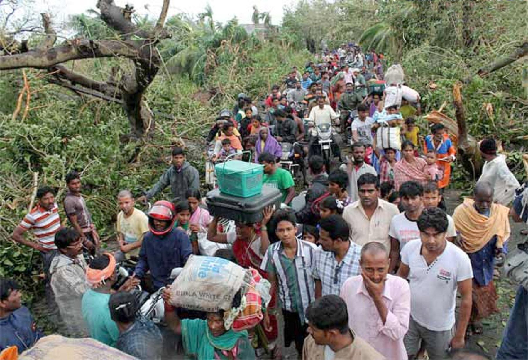 Villagers returning to their homes after Cyclone Phailin. Photo: LWSIT