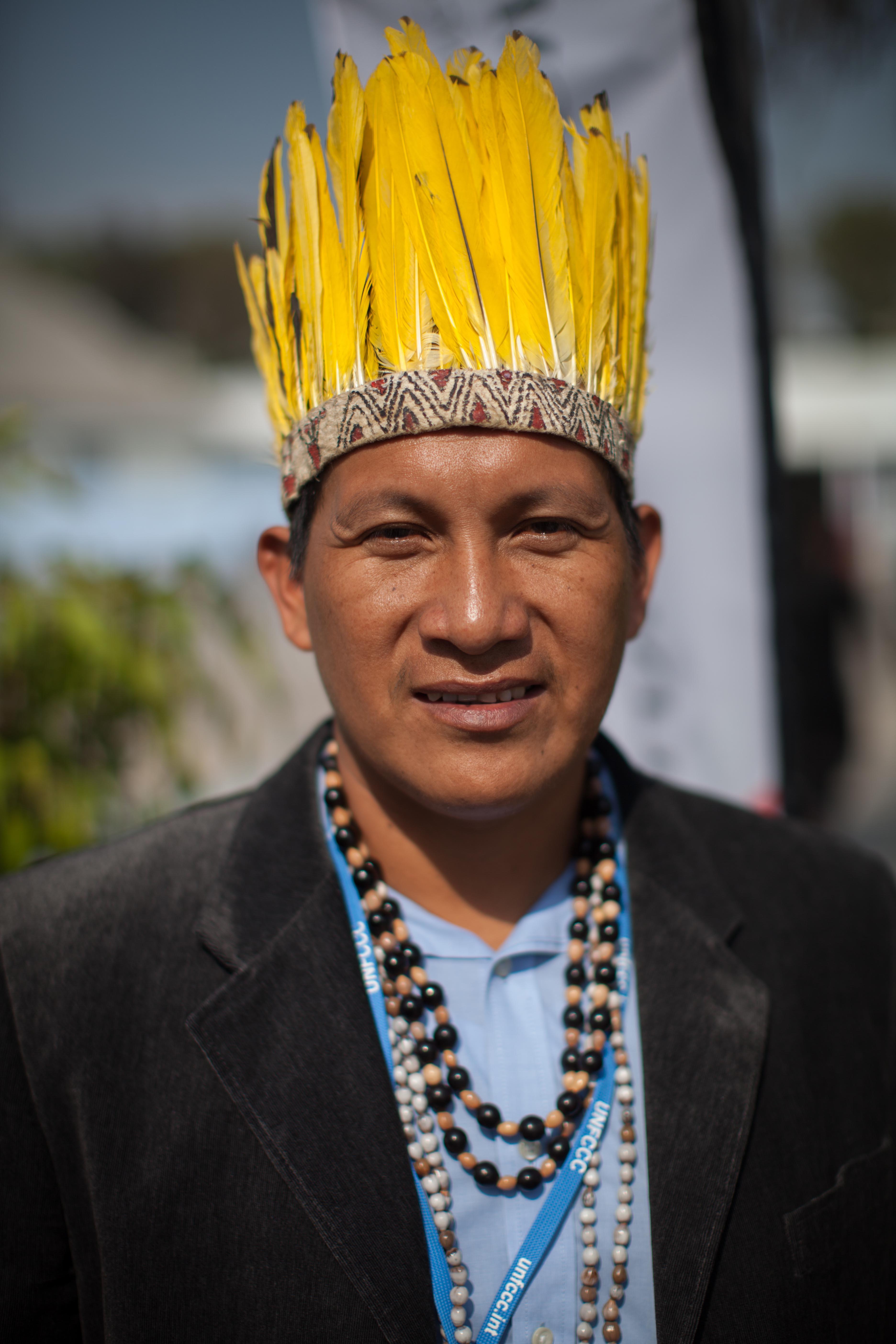 Activist displaying traditional headdress at COP20. Photo: LWF/Sean Hawkey