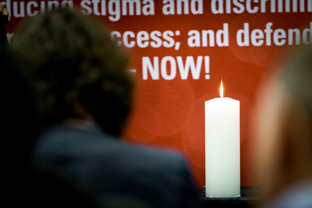 A candle is lit on the first day of Faith on the Fast Track, a meeting of faith organizations ahead of AIDS2016. Photo: WCC/Albin Hill