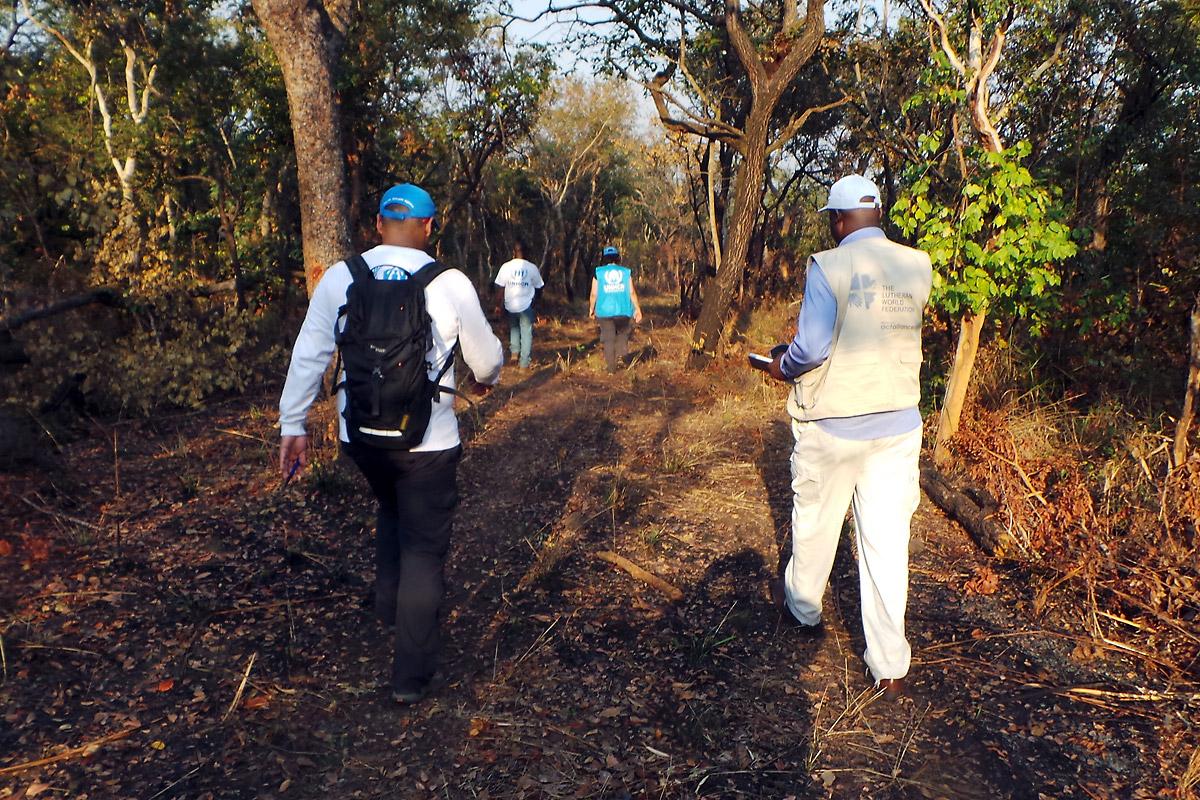 LWF and UNHCR staff survey a site designated for a new refugee camp in Lunda Norte province, northeastern Angola. Photo: LWF 