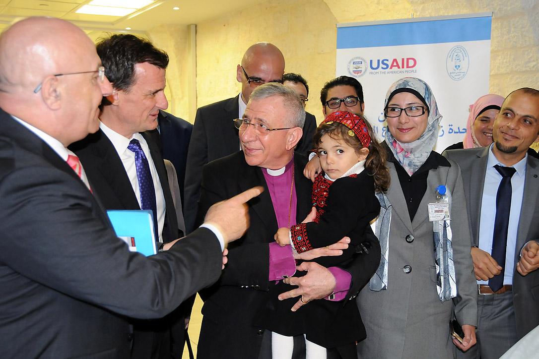 The ribbon cutting ceremony, led by Bishop Munib A. Younan, holding a child who may be undergoing a bone marrow transplantation in the newly opened Bone Marrow Transplant Unit. Photo: LWF Jerusalem