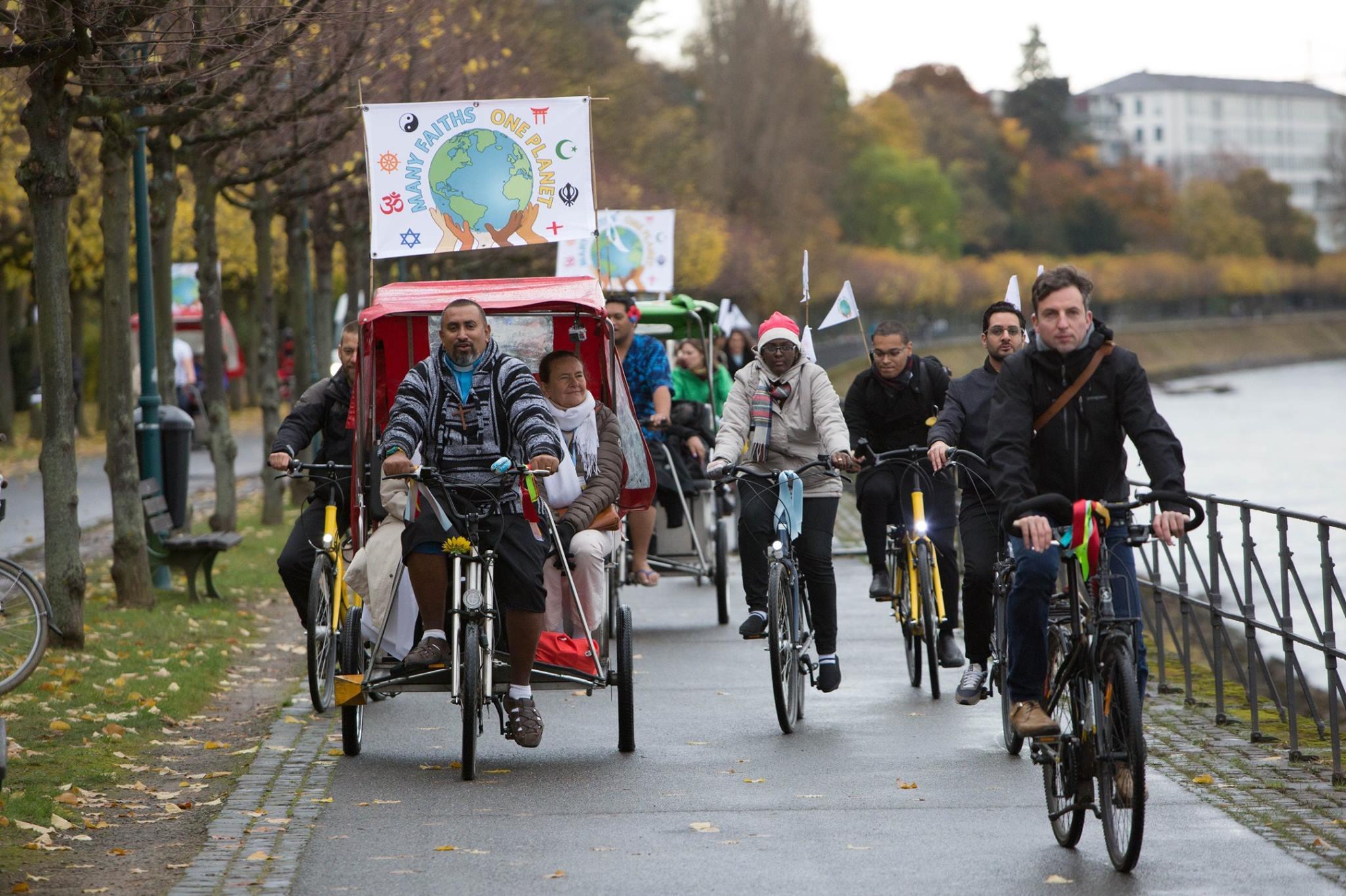 The statement was delivered by faith leaders on bicycles, promoting sustainable lifestyles. Photo: WCC/Sean Hawkey.