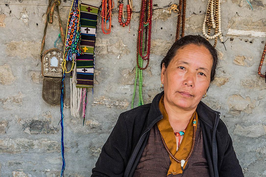 Tibetan refugee Kunsang Dolma sells jewelry made through LWF-training support for women groups. Photo: LWF/Christopher Waddell