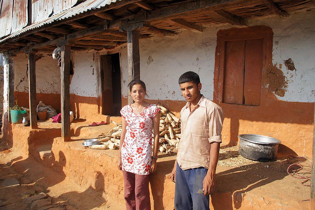 Laxmi and Laxman in front of their house. The outer walls of the house bear cracks. Inside, everything has collapsed. Photo: LWF/ C. KÃ¤stner