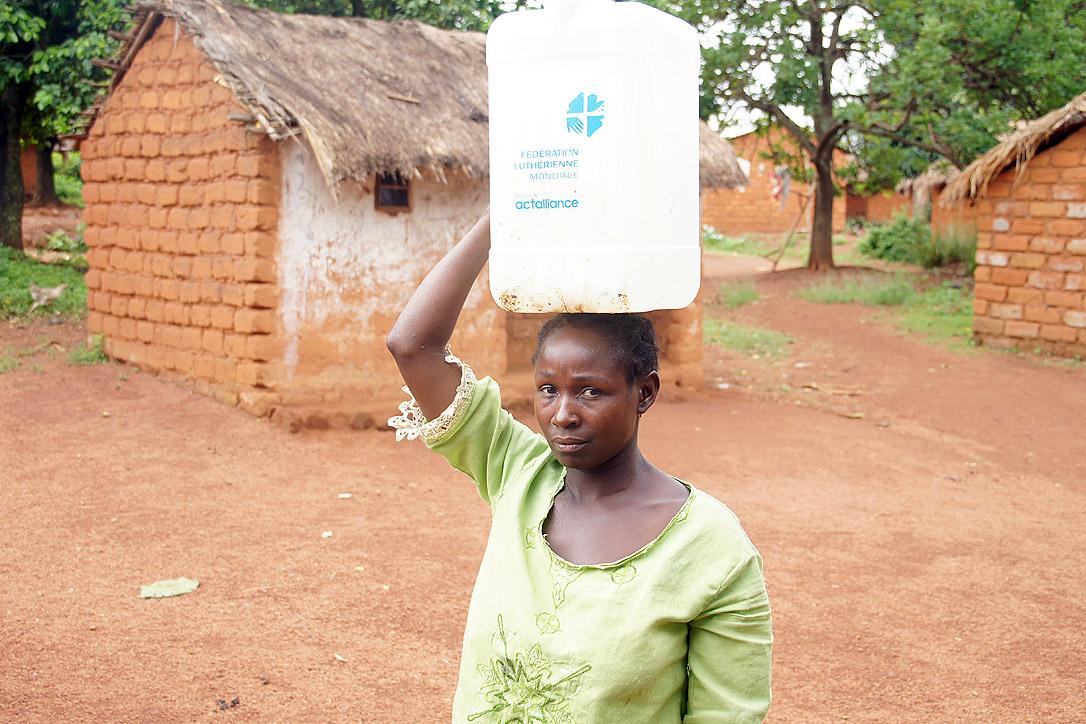 Rebecca Abbo returned to her damaged and empty house in Yongoro village, western CAR, in early May. With LWF's support, she can now access clean water. Photo: LWF/P. Mumia