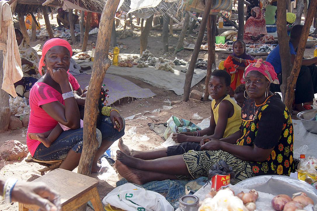 Cecile Endamag (far right) with her nephew and neighbor at her market stand. Photo: LWF/ C. KÃ¤stner