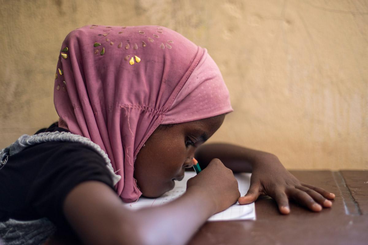 A girl from Somalia studies in an LWF primary school, Ali Addeh camp, Djibouti. LWF strongly advocated for girlâs education and against early marriage. Photo: LWF/ HelÃ©ne WikstrÃ¶m