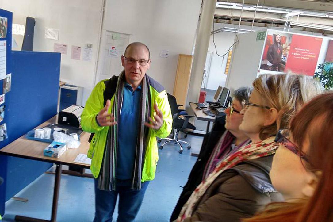 Dave Smith, founder of the Boaz Trust, which works with asylum seekers and refugees in Greater Manchester, explains the organization's work to members of the diakonia 