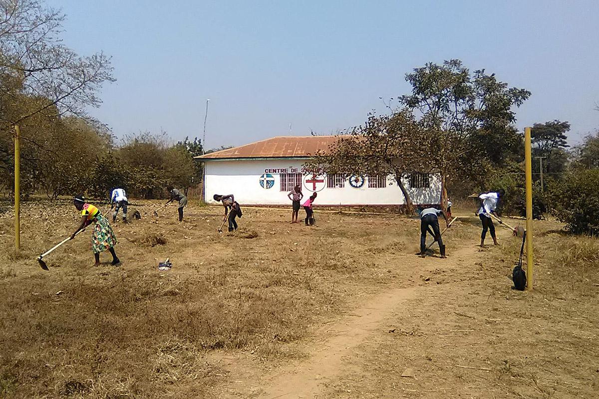 EELCO youth clear church grounds where new trees will be planted. Photo: Cedrick Y. Kitwa