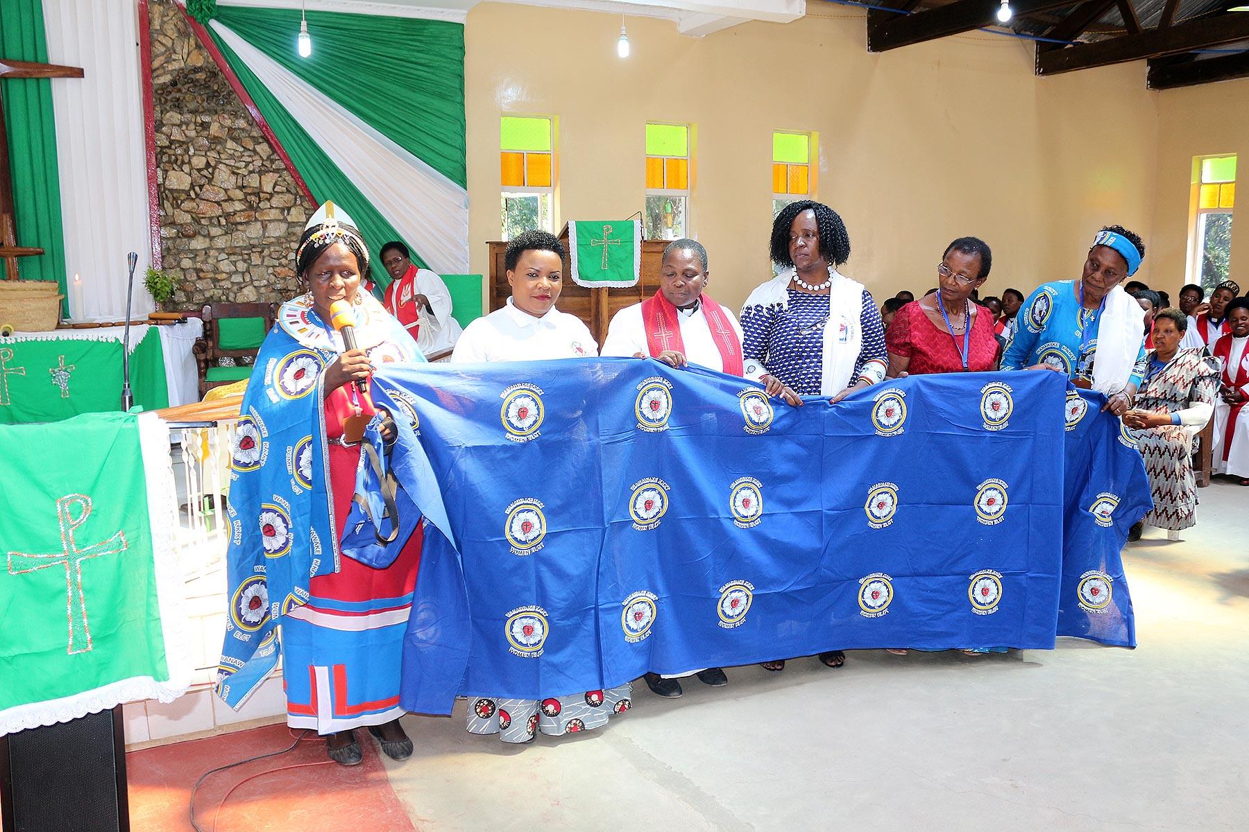 Members of the Executive Committee of the ELCT Women's Department display their national banner. All Photos: ELCT Communication/Evans Ayo
