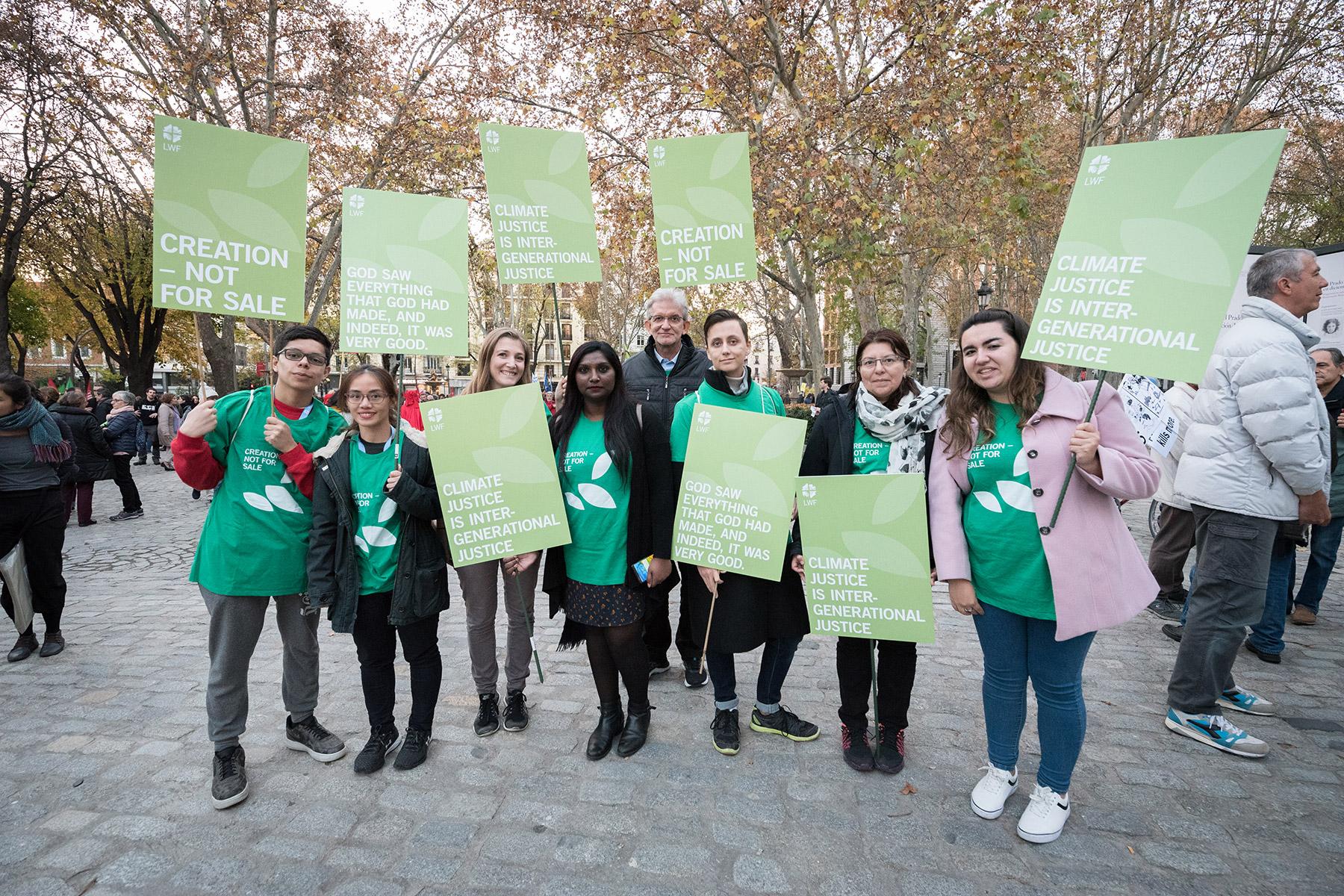 LWF delegates to COP25 taking place in Madrid, Spain, in 2019 preparing to join a march through the streets of central Madrid as part of a public contribution to the United Nations climate meeting, urging decision-makers to take action for climate justice. Photo: LWF/Albin Hillert