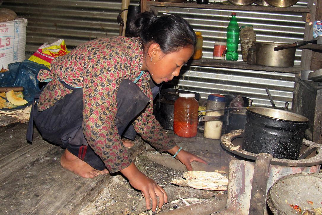 Nima Chhiyog Lama, 13, a seventh grader in Gatlang prepares food and takes care of her siblings before school. Surviving the earthquake is like being given a second life, she says. Photo: LWF Nepal