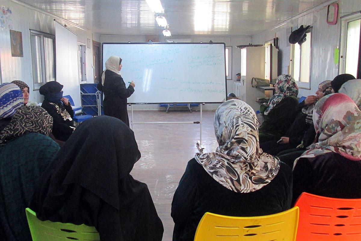 Wafeh shares her knowledge in the womenâs group. Photo: LWF/N. Boase