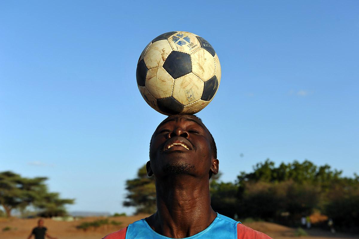Training session of FC Okapi, the soccer team currently holding third place in Kakuma premier league. The team trains every weekday afternoon. As they have their own field, they have better training opportunities than the more informal soccer teams. Photo: LWF/ C. KÃ¤stner