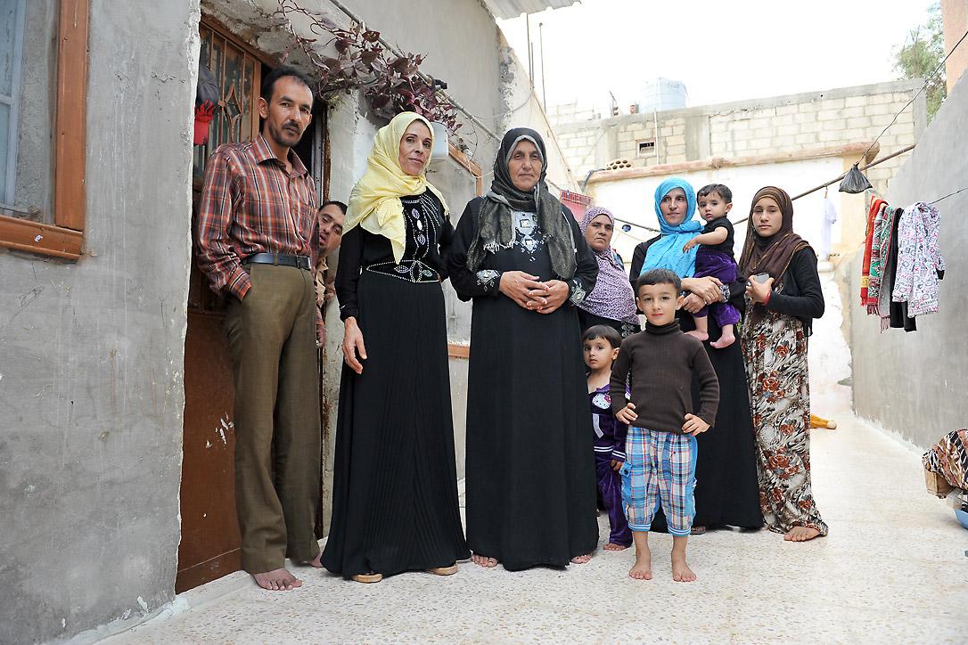  A Syrian family living in an unfinished building in Al Mafraq. Many refugees have to trade their food vouchers to pay the rent. Photo: LWF/ M. Renaux