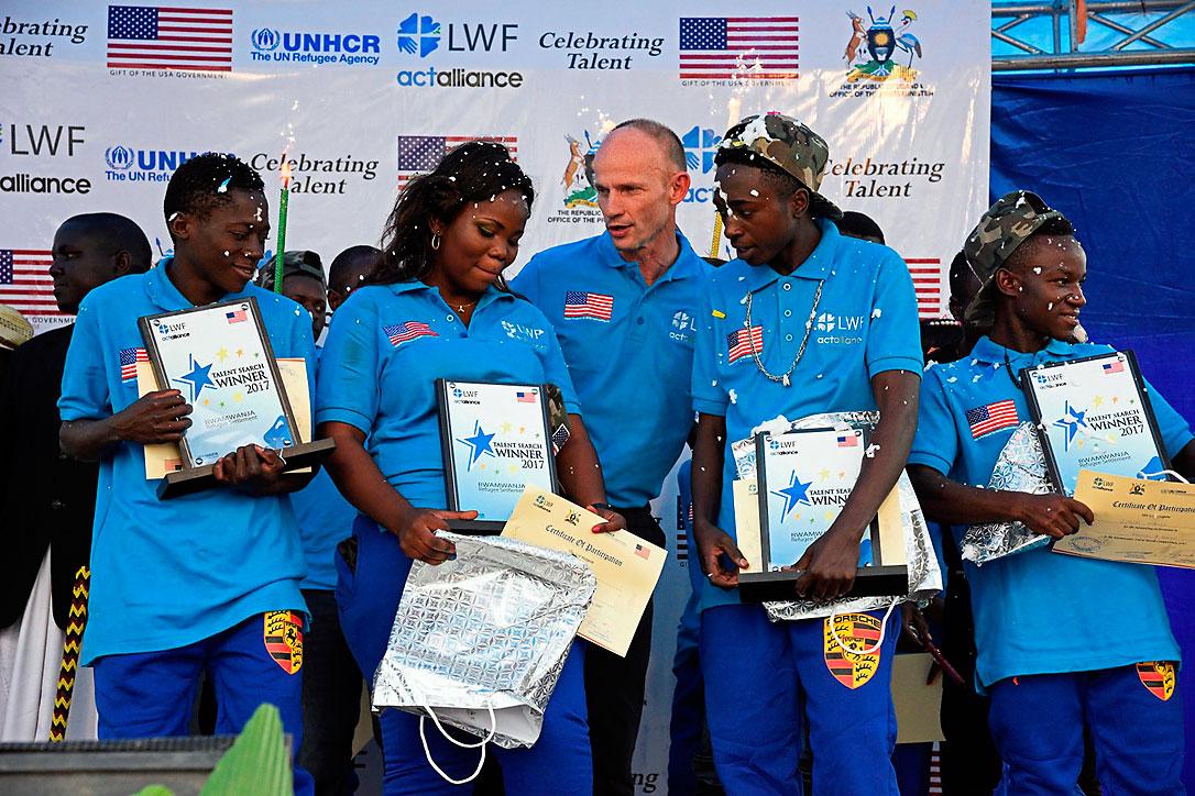 Jesse Kamstra, LWF country representative in Uganda (center), with the winners of the contest. Photos: LWF/ S. Nalubega