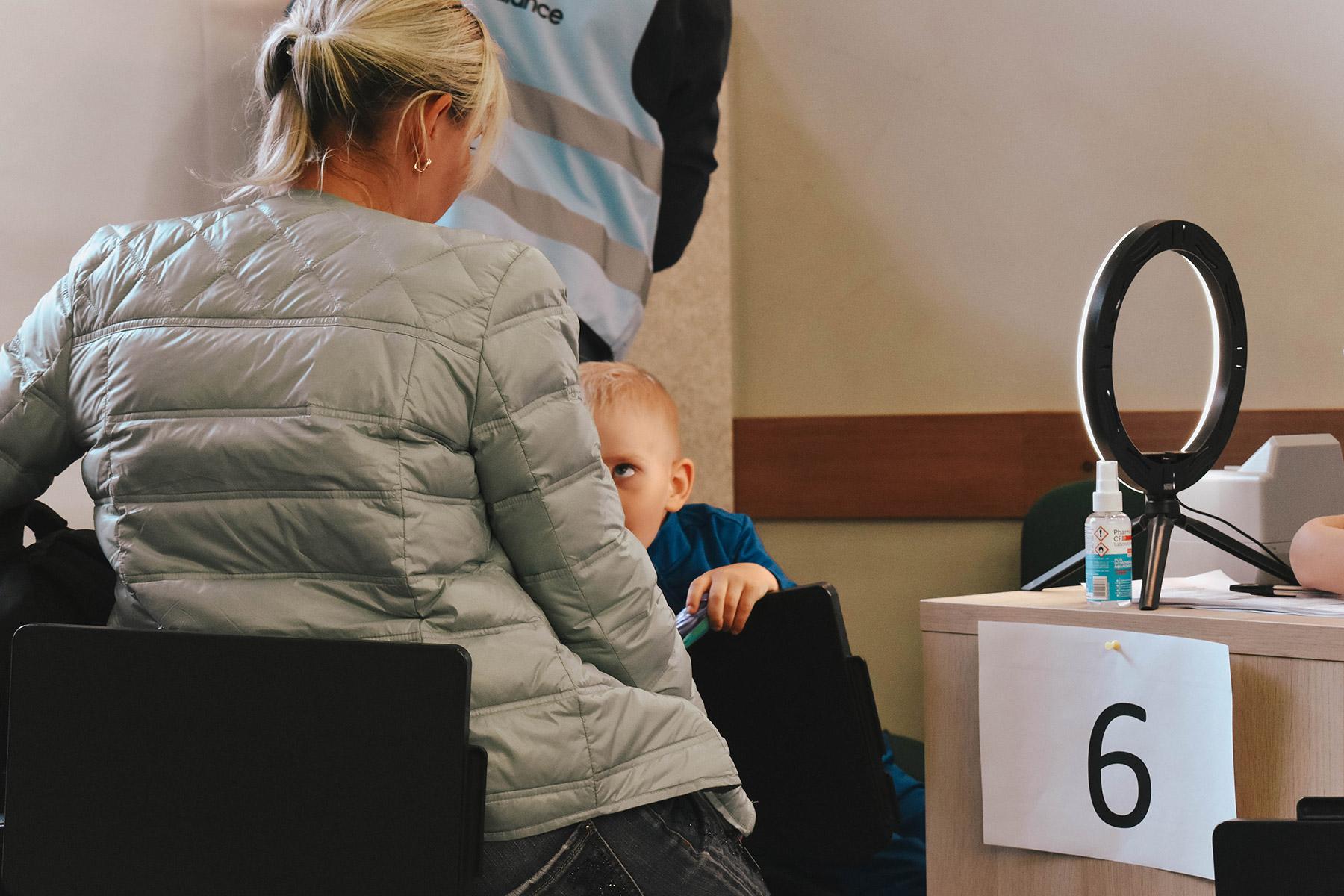 A woman and her son register at the enrolment stations in the Gdansk refugee center. Photo: LWF/ Krysztof Tylicki