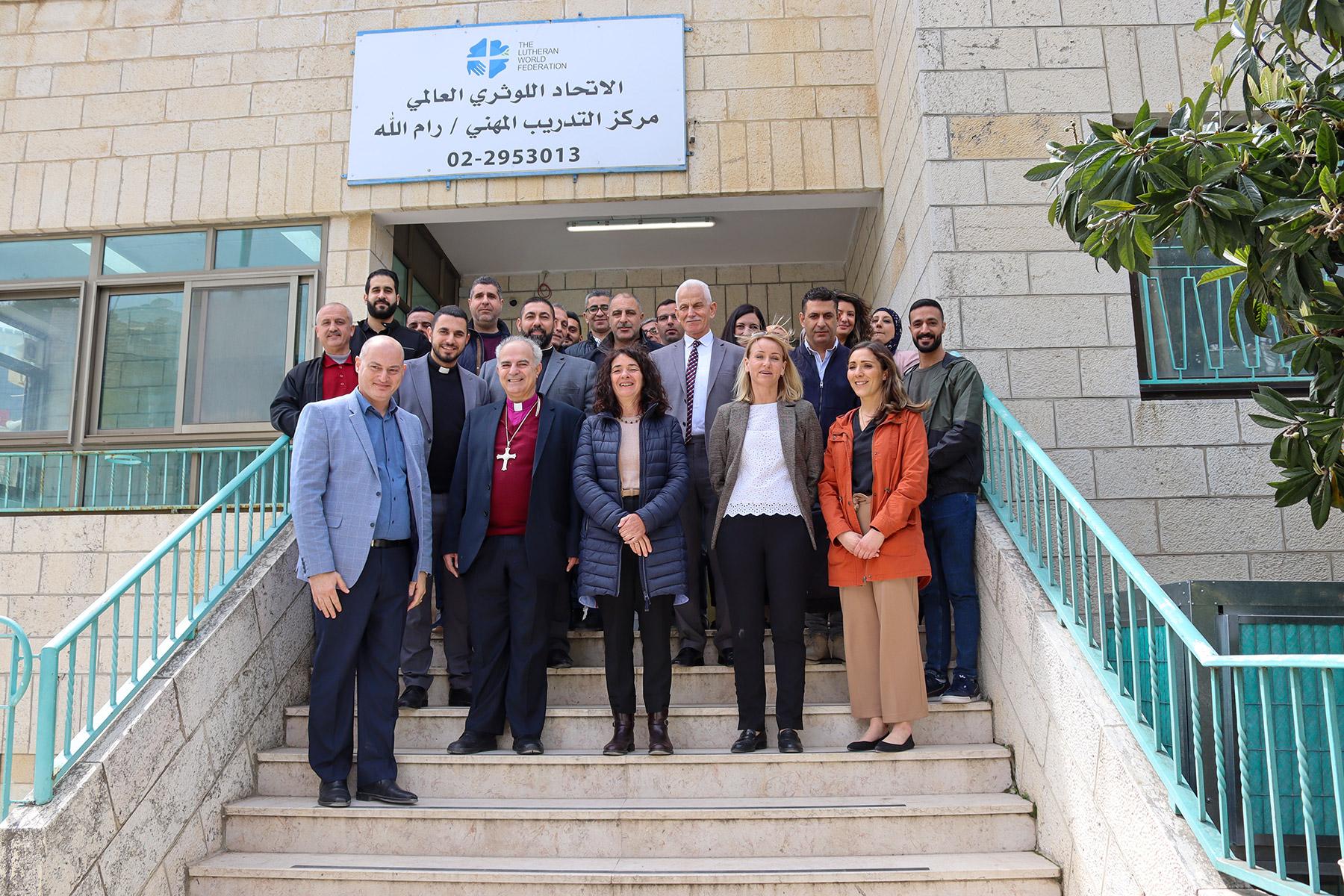 Outside LWF's vocational training center in Ramallah â front row from left, program director Yousef Shalian, Bishop Ibrahim Azar, LWF Representative Sieglinde Weinbrenner, LWF Regional Program Coordinator Caroline Tveoy and Heather Platt from Canadian Lutheran World Relief. The ELCJHLâs director of education Dr Charlie Haddad and the ELCAâs Rev. Gabi Aelabouni are behind them. All photos: Abd Al Rahman Hadidi