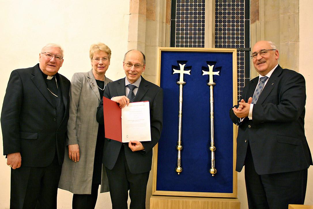 Well-wishers and honorary doctor: (from left) Bishop Brian Farrell, secretary of the PCPCU; Prof. Dr Myriam Wijlens from Erfurt University, Prof. Dr Theodor Dieter with his award and Prof. Dr Michael Gabel, dean of the Catholic Theology faculty at Erfurt University. Photo: Erfurt University