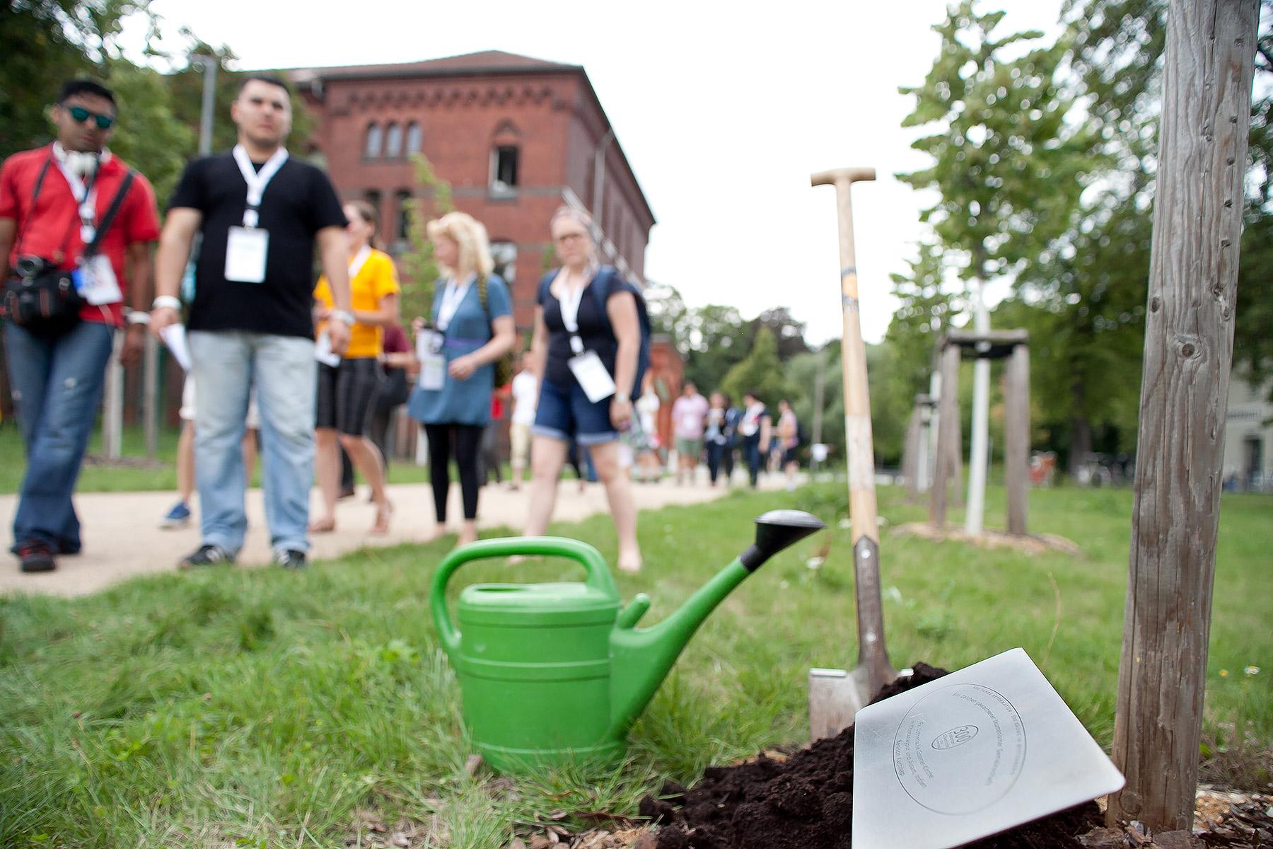 Symbolic tree planting in the Luthergarten in Wittenberg, Germany, during the global young reformers meeting, Workshop Wittenberg, in 2015. Photo: LWF/Marko Schoeneberg
