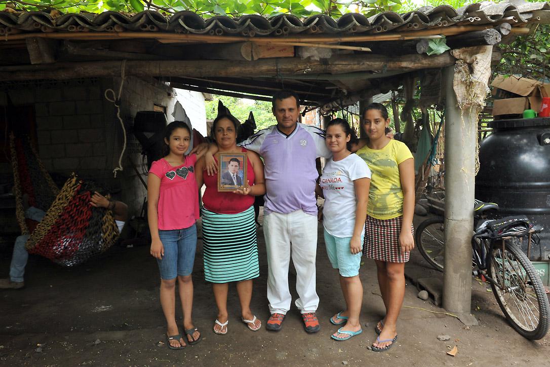 Rigoberto and his family with an image of their son, who was kidnapped on the migration route to the US. Photo: LWF/C. KÃ¤stner