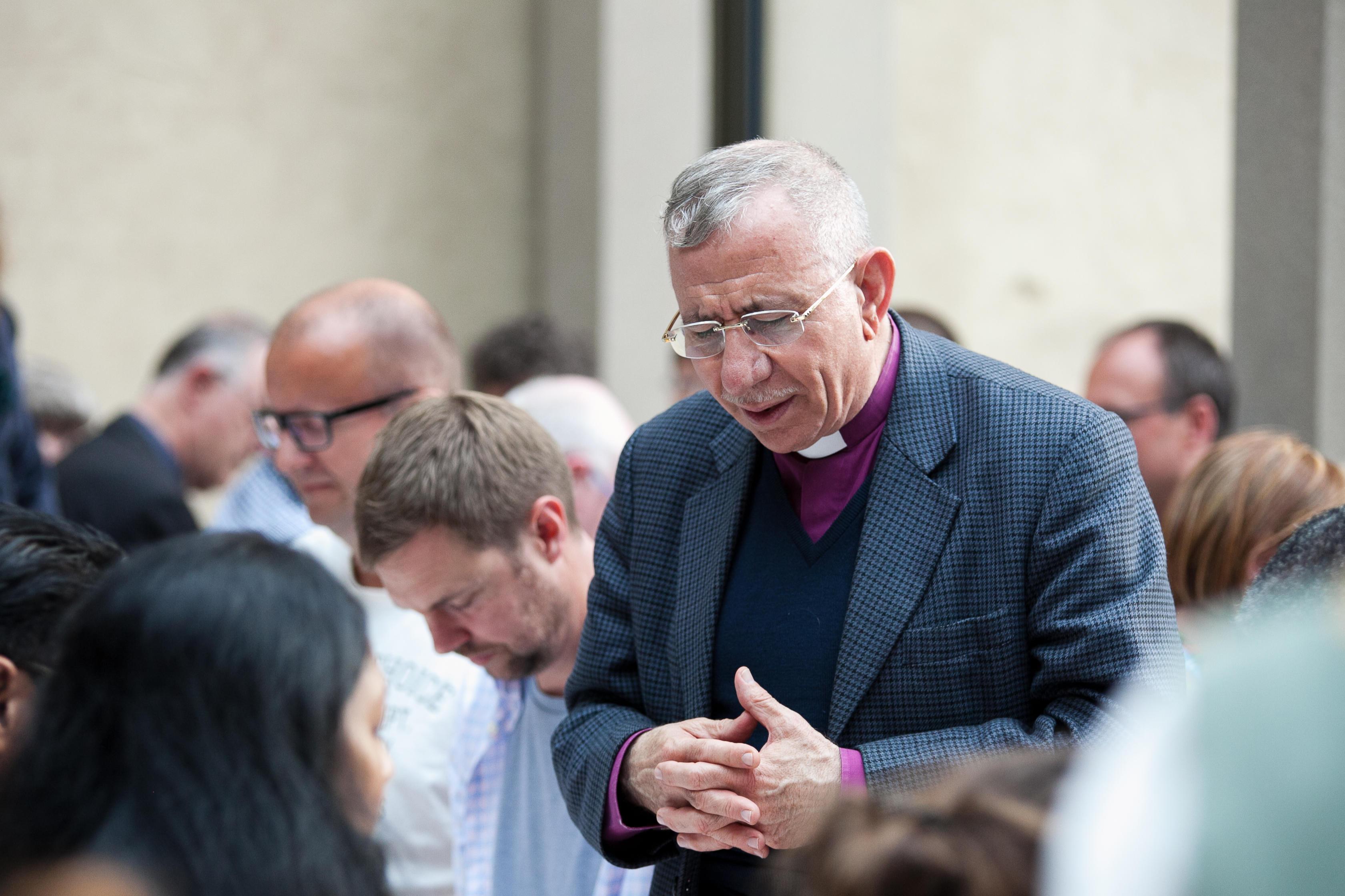Bishop Dr. Munib Younan, President of the Lutheran World Federation, saying grace at the 2016 LWF Council in Wittenberg. Photo: LWF / Marko Schoeneberg
