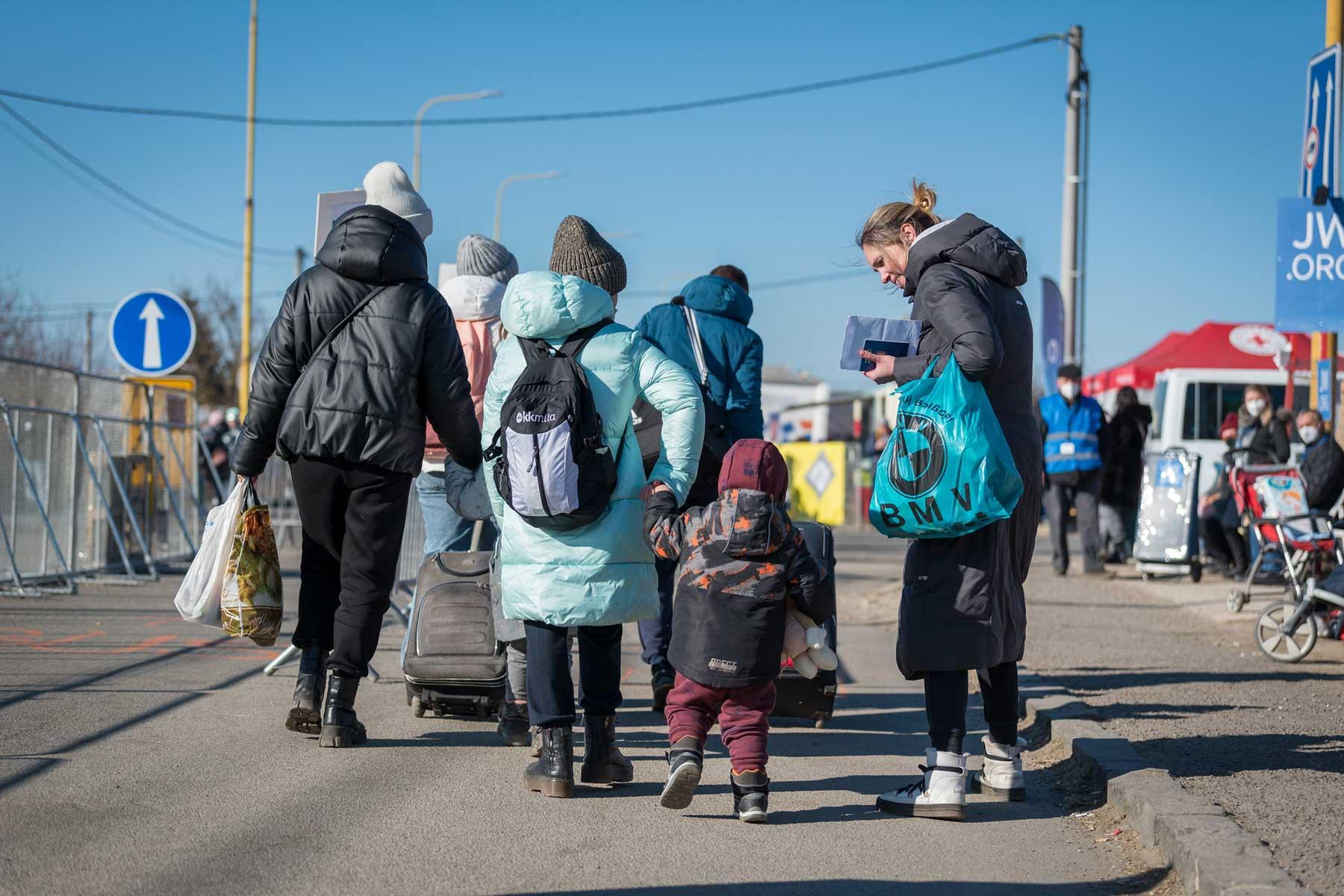 Women and children flee across the border between Slovakia and Ukraine following the Russian invasion in February 2022. Photo: LWF/A. Hillert