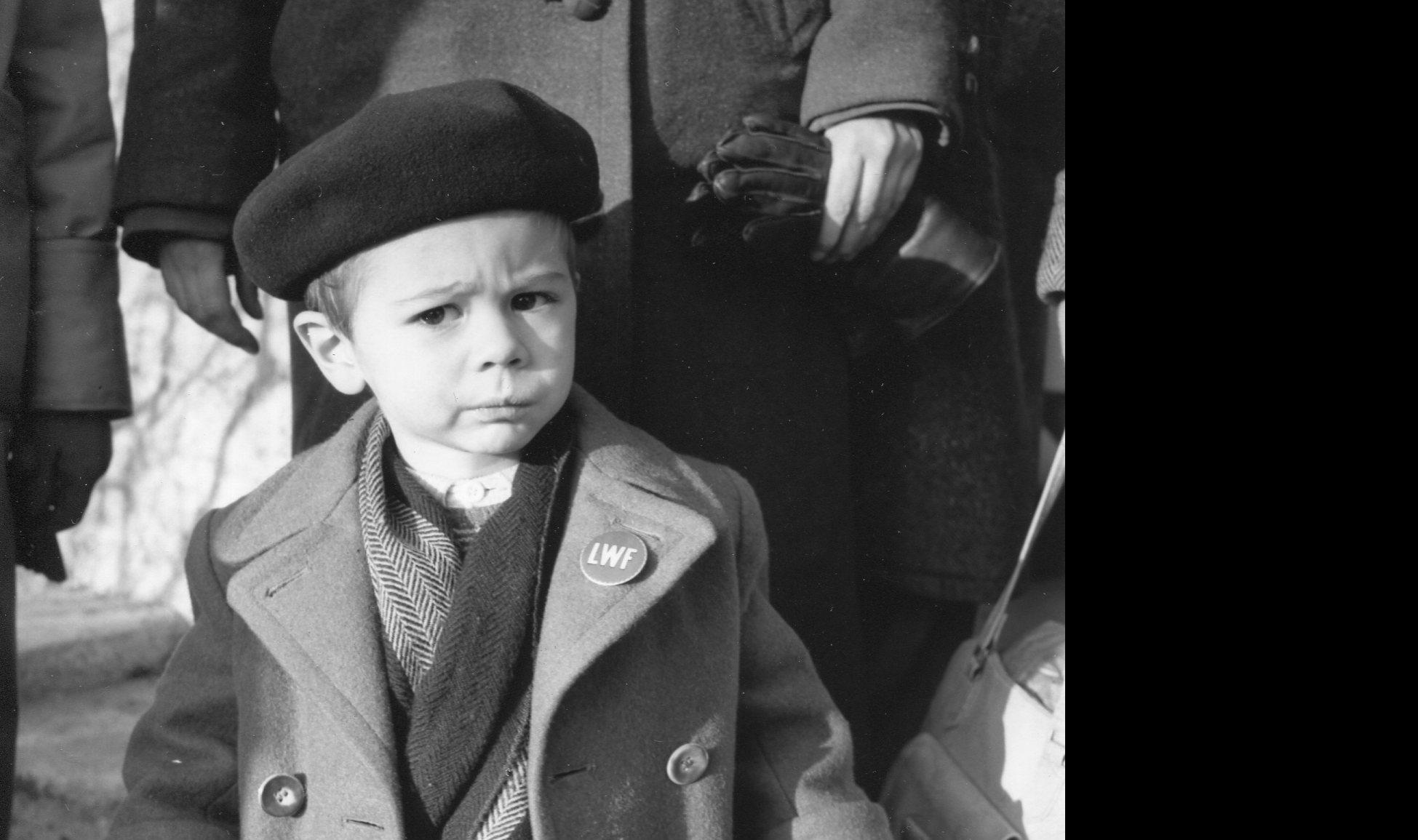 In the aftermath of the Second World War, the LWF supported thousands of displaced people in Europe. The young boy wearing an LWF pin on his coat lapel represents those pushed to leave their homes and find refuge elsewhere. Photo: LWF Archives