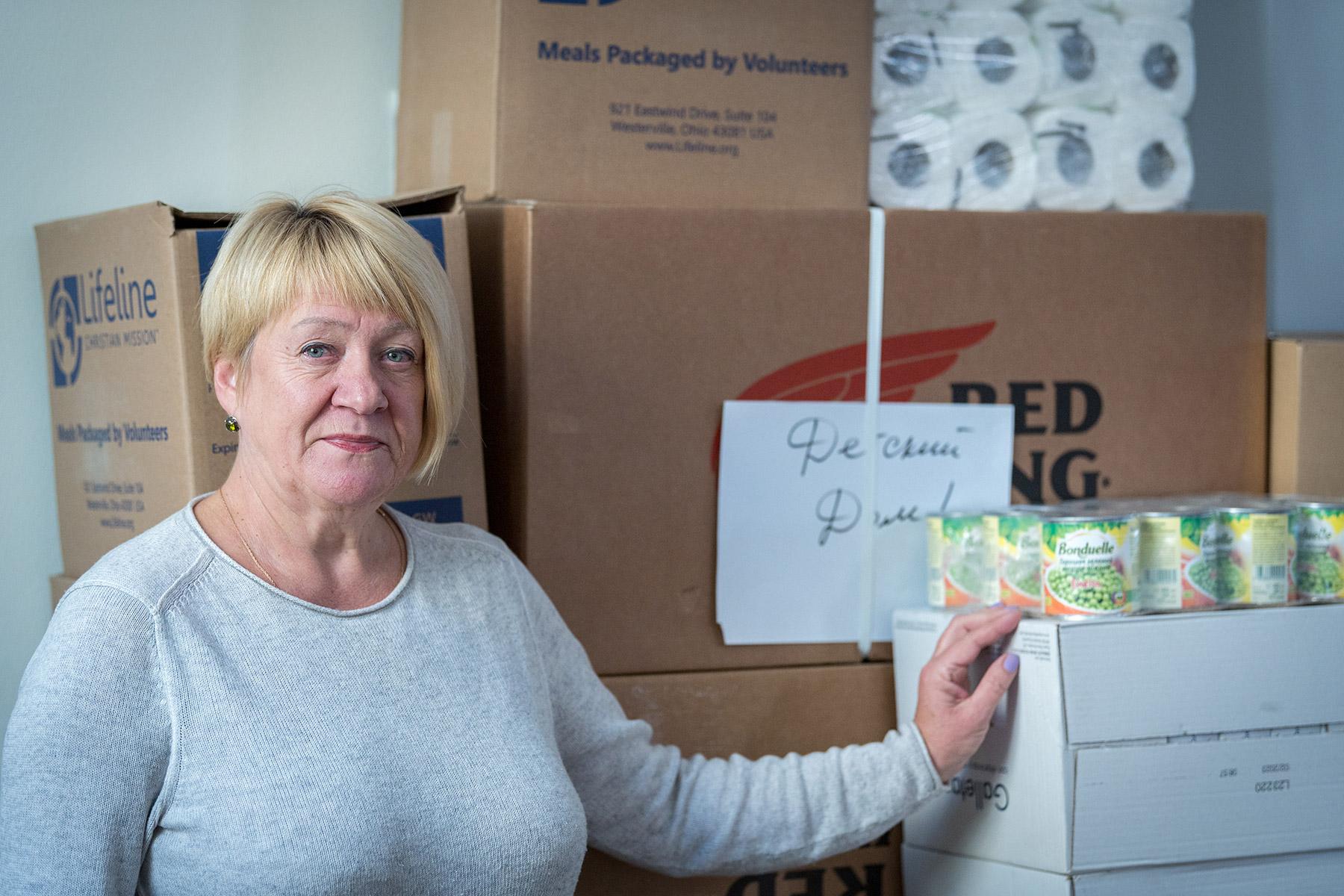 Lidija Tselsdorf, Head of the German Evangelical Lutheran Church of Saint Catherine in Kyiv with supplies packed and ready to be shipped to communities in need. GELCU has been helping its congregations and surrounding communities with relief goods. Photo: LWF/Albin Hillert