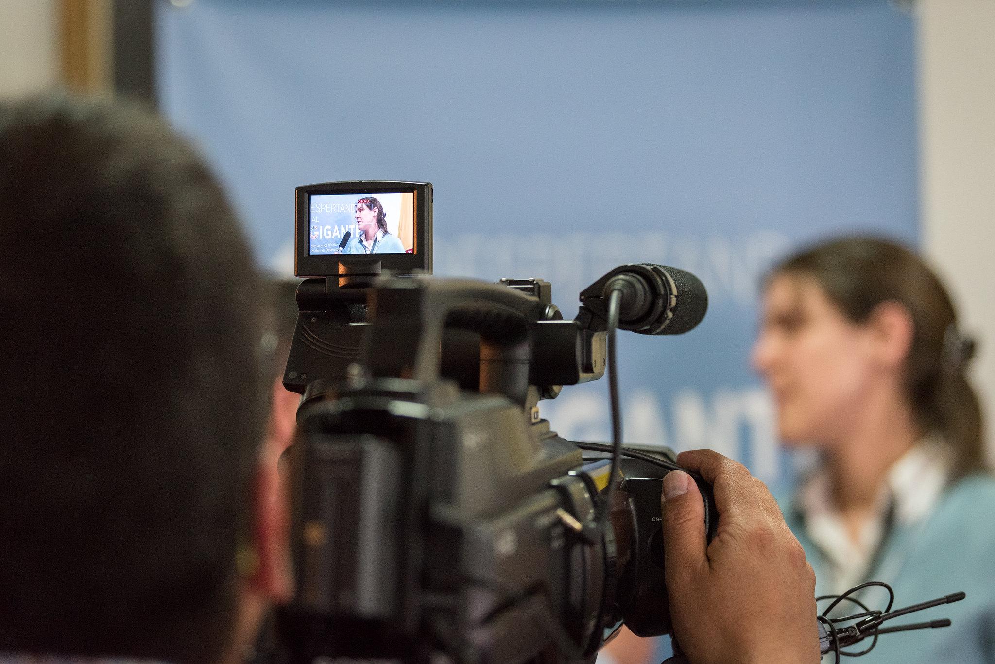 Journalists interview LWF staff at the official launch of ’Waking the Giant’ in Colombia. Photo: LWF/Albin Hillert