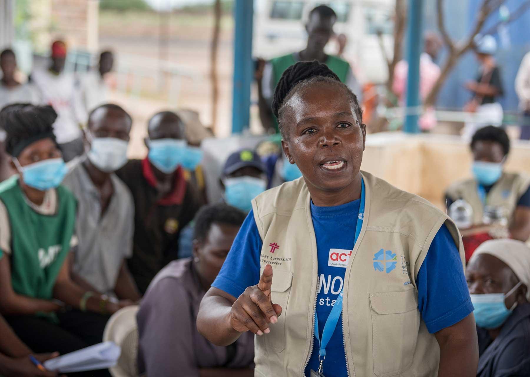 Livelihoods officer Hilda Thuo gives instructions for the distribution of core relief items to refugees at the reception centre of the Kalobeyei refugee settlement near Kakuma refugee camp, Kenya. Photo: LWF/ Albin Hillert