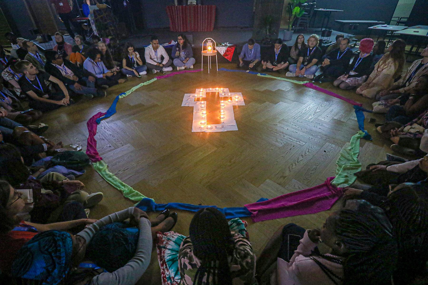 Participants from the LAC region lead evening devotion at the September 2023 LWF Youth Pre-Assembly in Wisła Malinka, Poland. Photo: LWF/Johanan Celine Valeriano