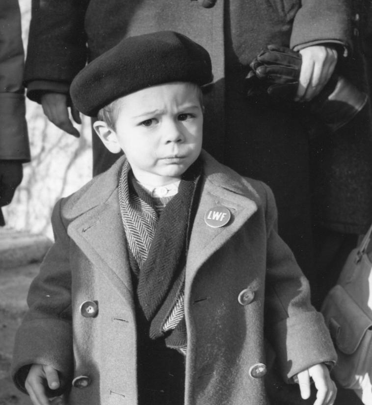 In the aftermath of the Second World War, the LWF supported thousands of displaced people in Europe. The young boy wearing an LWF pin on his coat lapel represents those pushed to leave their homes and find refuge elsewhere. Photo: LWF Archives