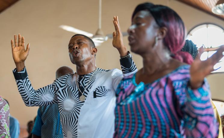Worship and prayer moment during Sunday service at Saint Andrew Lutheran Parish in Monrovia, Liberia. Photo: LWF/Albin Hillert
