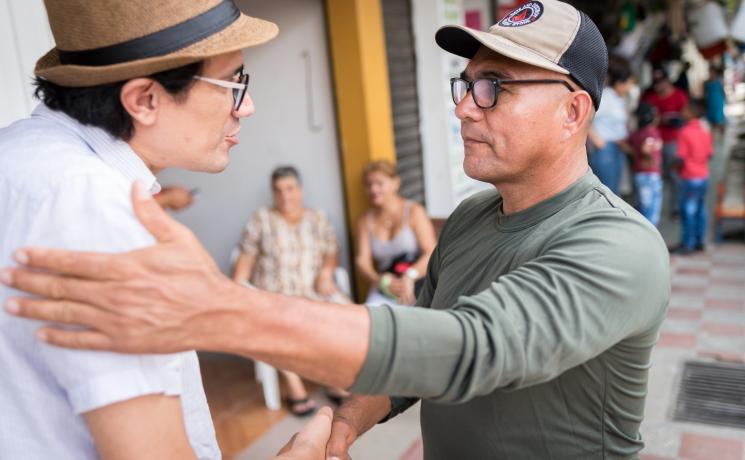 The Evangelical Lutheran Church of Colombia accompanies ex-combatants and the communities into which they are reintegrating. Here, former FARC commander "Harrison" greets Lutheran pastor Rev. John Hernández. Photo: LWF/Albin Hillert