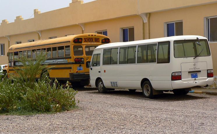 The yellow school bus in Markazi refugee camp that transports children from the refugee camp to school each day. Photo: ALWS/ Jonathan Krause