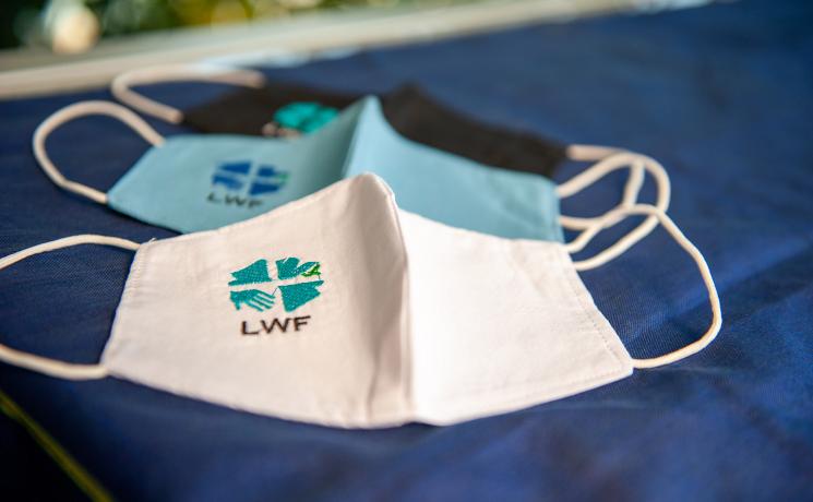 Wear it, share it. LWF embroidered protective face masks. Photo: LWF/S. Gallay 
