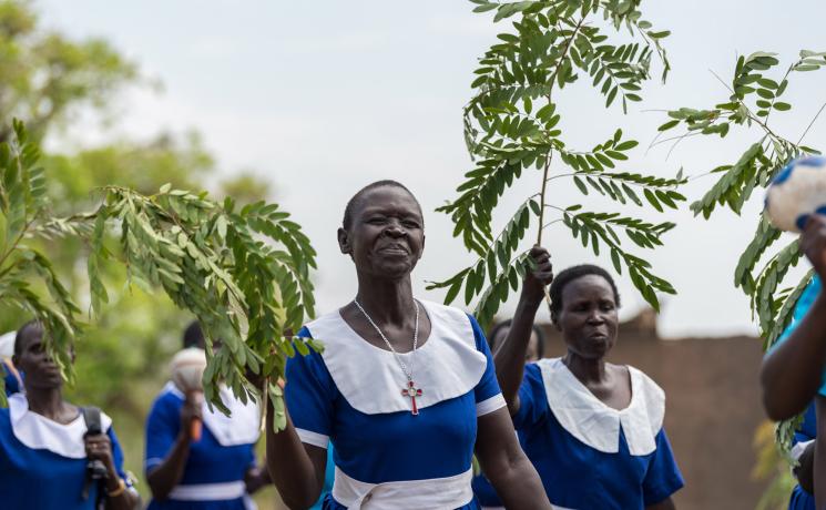 A group of women from the Kajo-Keji Diocese march to church in the refugee settlement of Palorinya in Obongi district, West Nile area of northern Uganda. All photos: LWF/Albin Hillert 