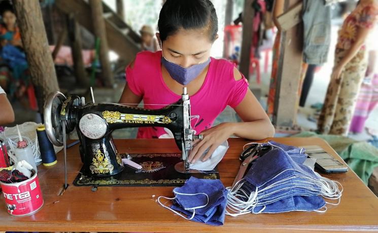 A woman entrepreneur sews cloth face masks in Sittwe, Rakhine State, Myanmar. Photo: LWF/Nu Nu Aye